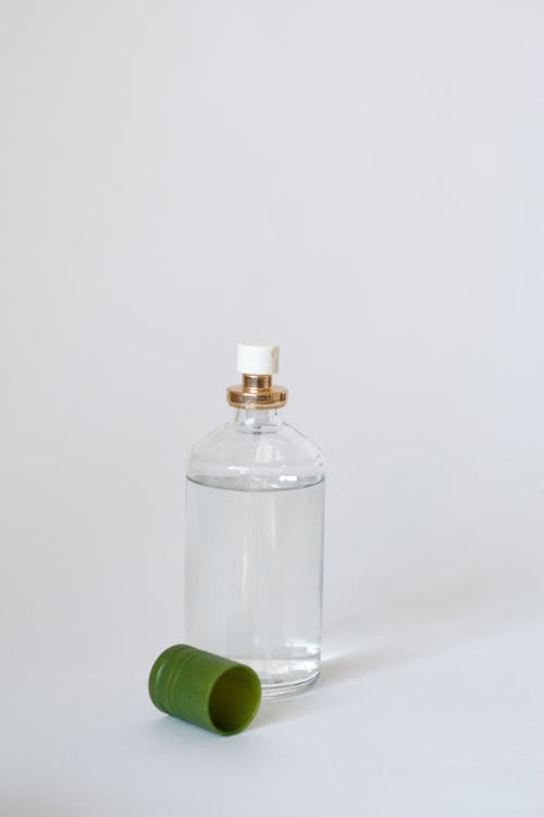 Clear Glass Bottle With Green Cap