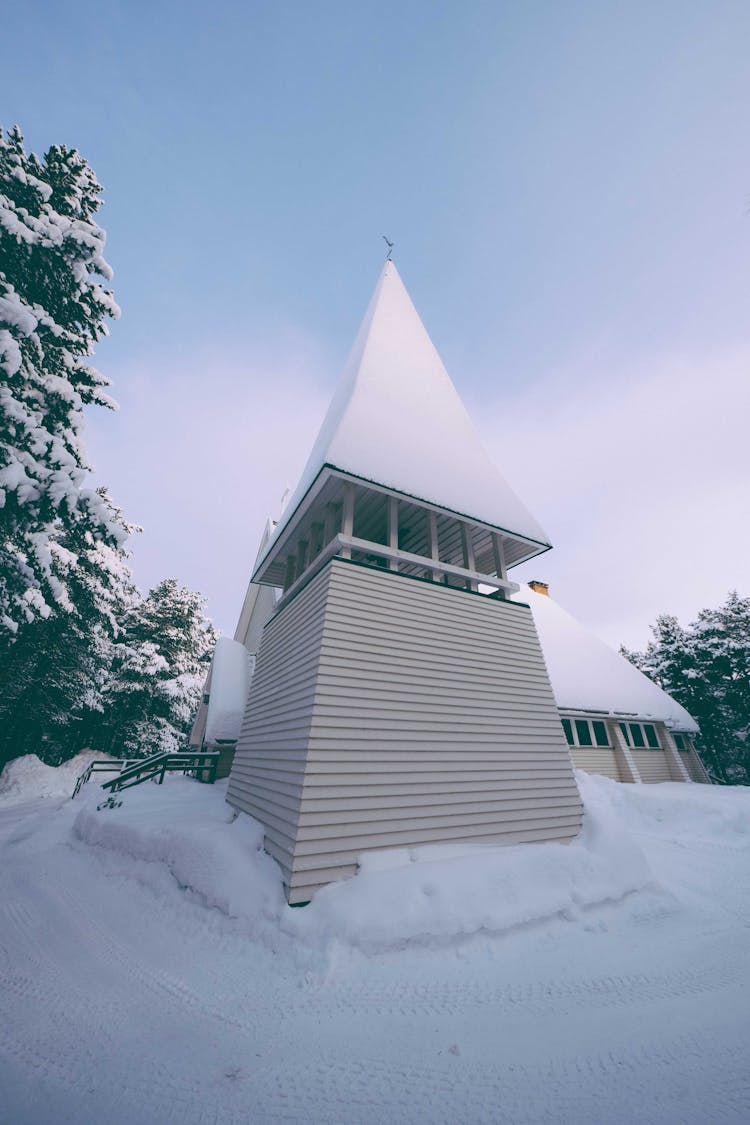 Modern Triangle Shaped Chapel In Snowy Countryside