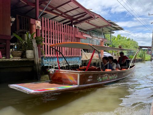 Free A colorful long tail boat transports people through the scenic canals of Amphawa, Thailand. Stock Photo
