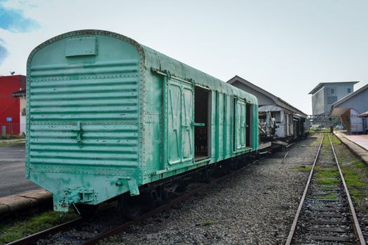 Rustic green train carriage at Gemas Station, Negeri Sembilan, Malaysia.