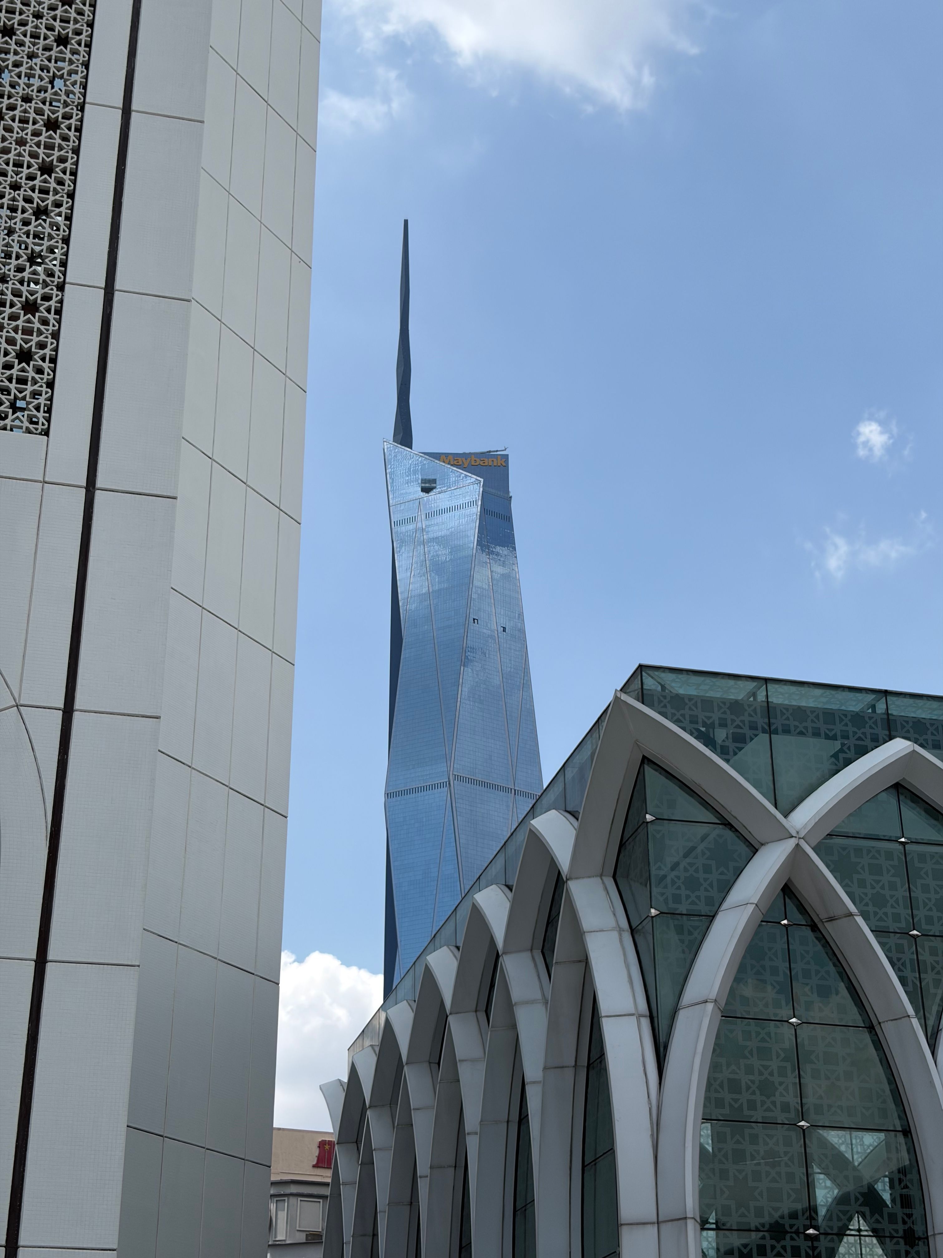 Stunning view of Kuala Lumpur's modern architecture with a blue sky backdrop.