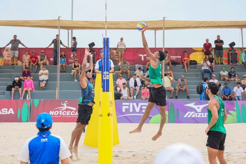 Free Action-packed beach volleyball game with athletes and spectators in Ciudad Madero, Mexico. Stock Photo