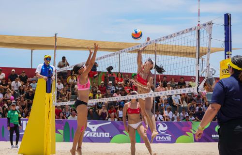 Free Exciting beach volleyball game with athletes in Ciudad Madero, Tamaulipas. Stock Photo