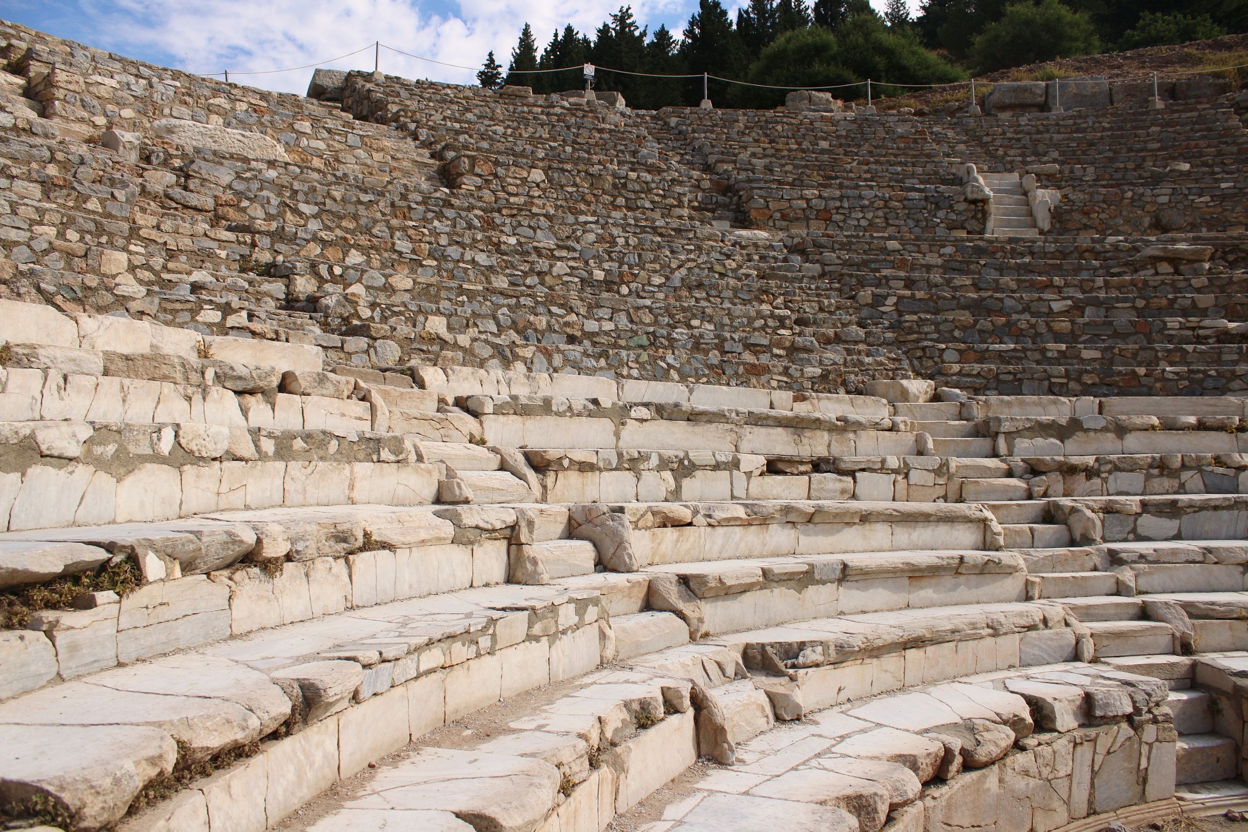 Ancient ruins of Delphi archaeological site in Greece, nestled in a mountainous landscape