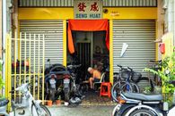 Traditional workshop with motorbikes and bicycles in Georgetown, Penang.