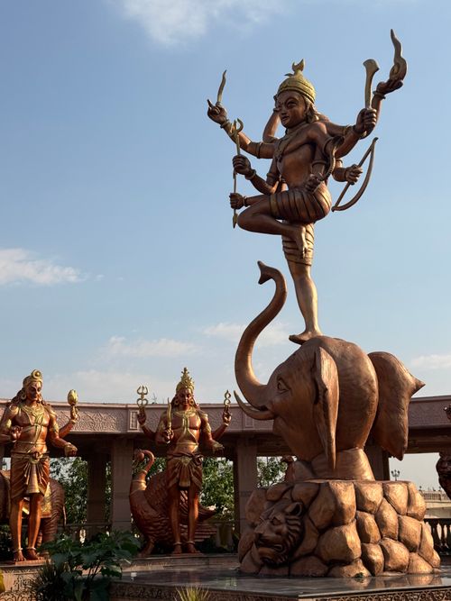 Free Stunning sculpture of religious figures at a temple in Ujjain, India, under a clear blue sky. Stock Photo
