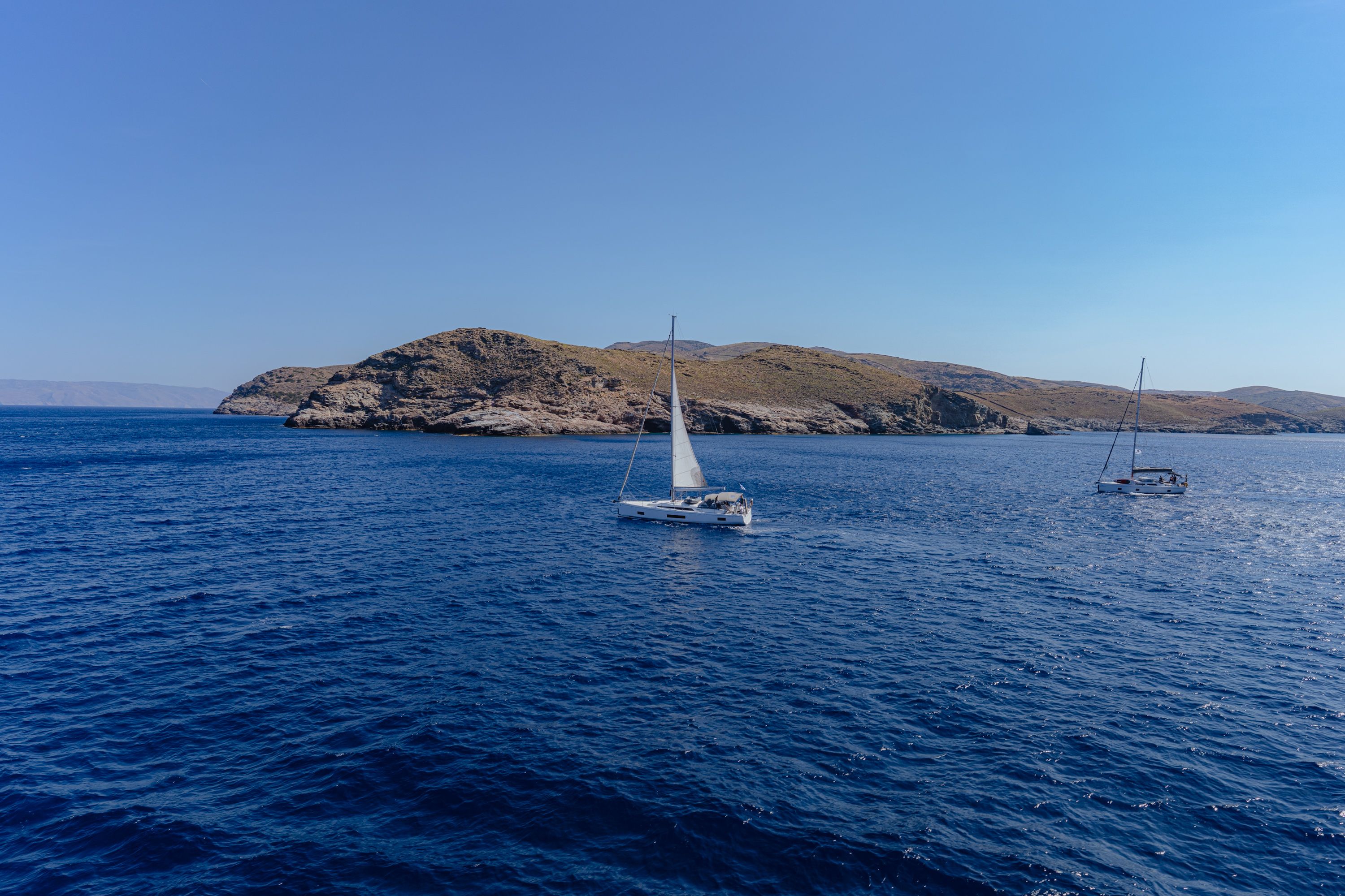 Unbeatable Full-Day Charter in Tortola British Virgin Islands Review: Your Ultimate Luxury Yacht Adventure Review 2026 - Sailboats cruising near rocky islands in Greece under clear blue skies.