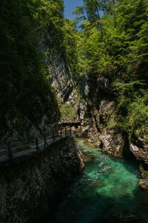 Free Explore the breathtaking gorge with crystal-clear turquoise waters and lush greenery. Stock Photo
