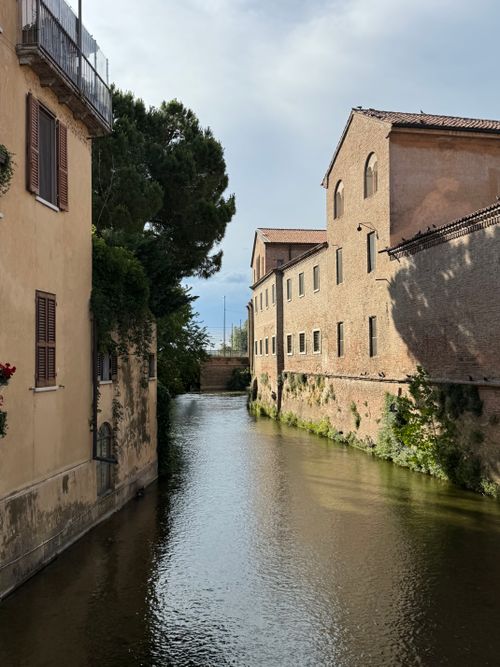 Free Scenic view of a historic canal surrounded by classic architecture in Mantova, Italy. Stock Photo