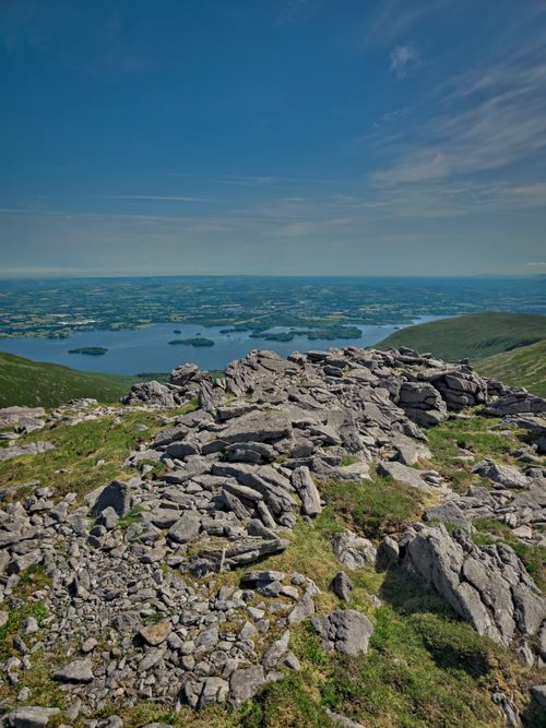 Free Beautiful panoramic view of Irish landscape featuring rocky mountain and lake Stock Photo