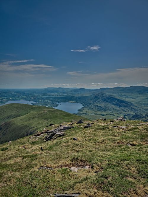 Free Breathtaking view of Irish mountains and lake under a clear blue sky. Stock Photo