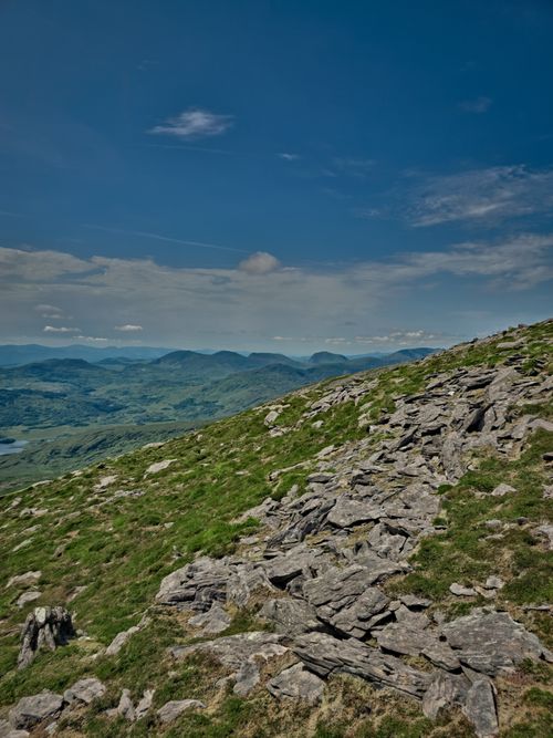 Free Stunning landscape view of rocky terrain in the Kerry mountains, Ireland under a clear blue sky. Stock Photo
