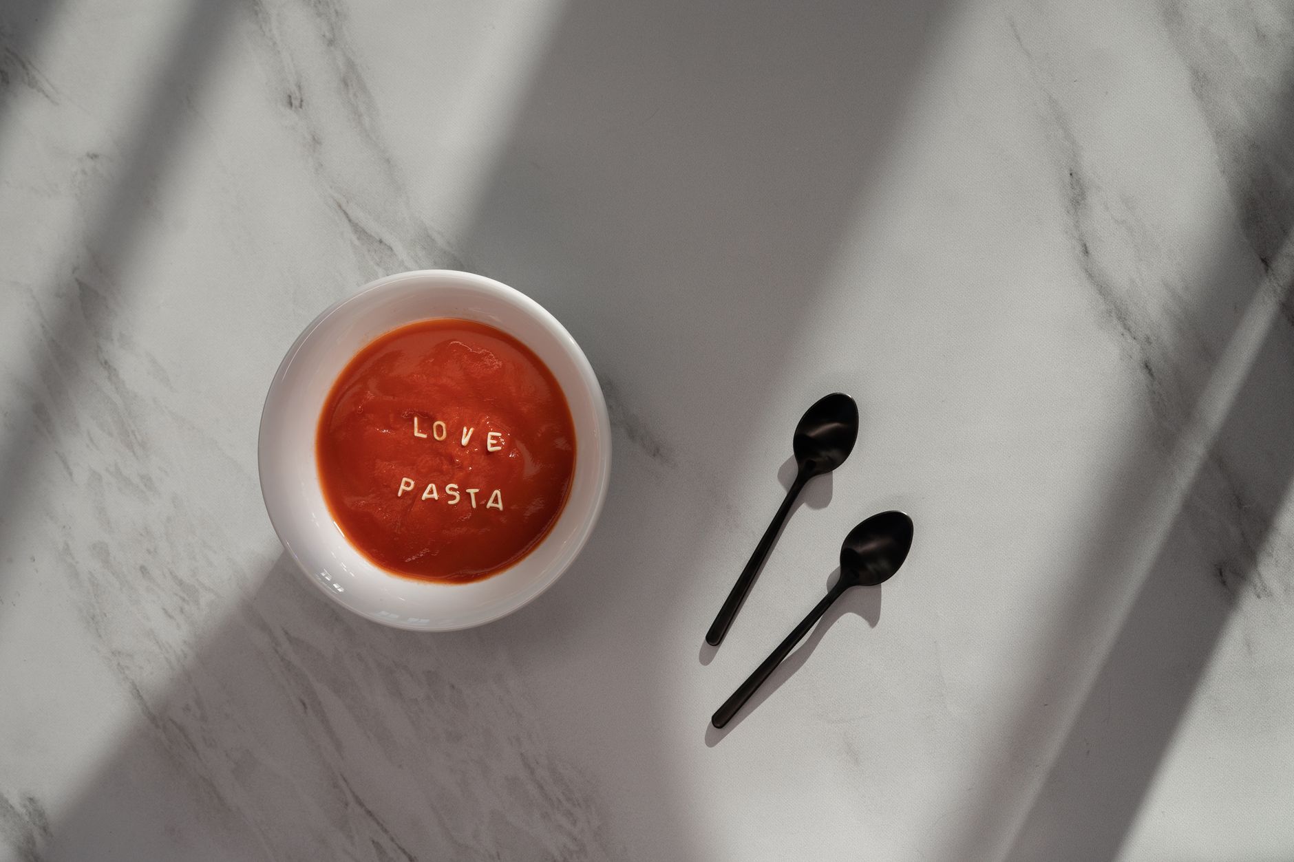 Close-up of Pasta Pomodoro with fresh basil garnish