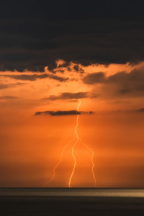 Free Spectacular lightning during sunset over the ocean at Cửa Tùng, Quảng Trị, Vietnam. Stock Photo