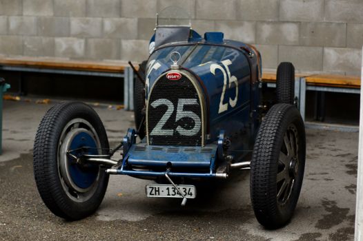 Front view of a vintage Bugatti race car with license plate ZH-133434 in Switzerland.