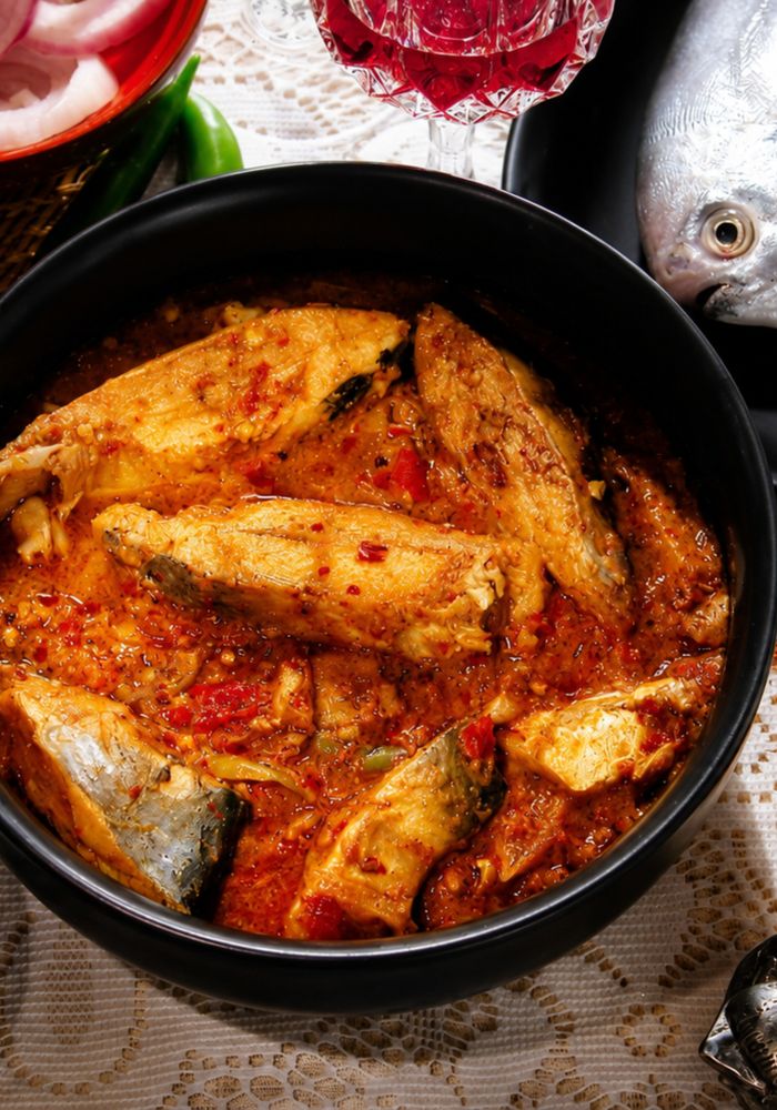 Fresh fish with coconut and curry ingredients ready to cook