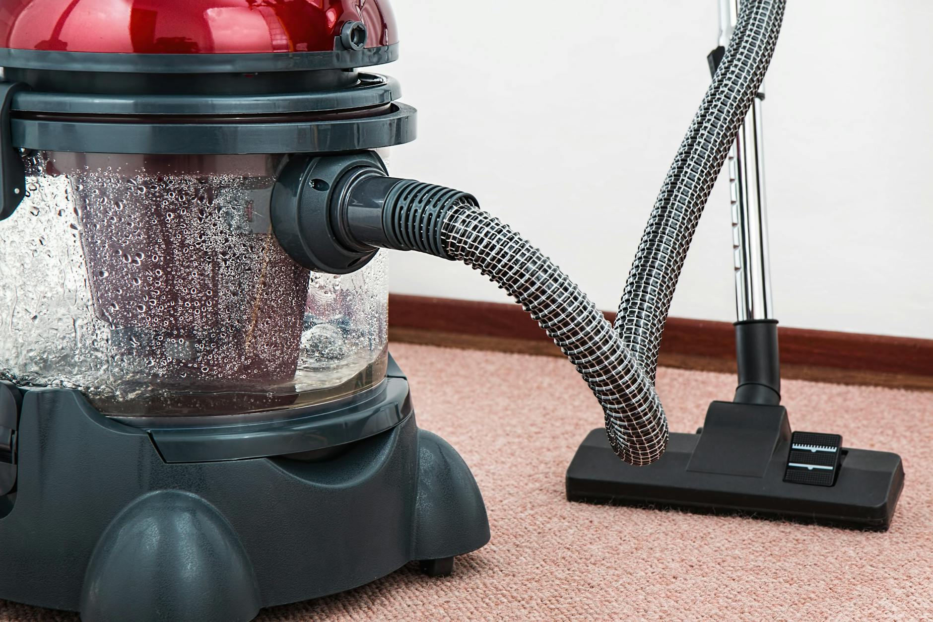 Modern vacuum cleaner with water filtration cleaning carpet floors