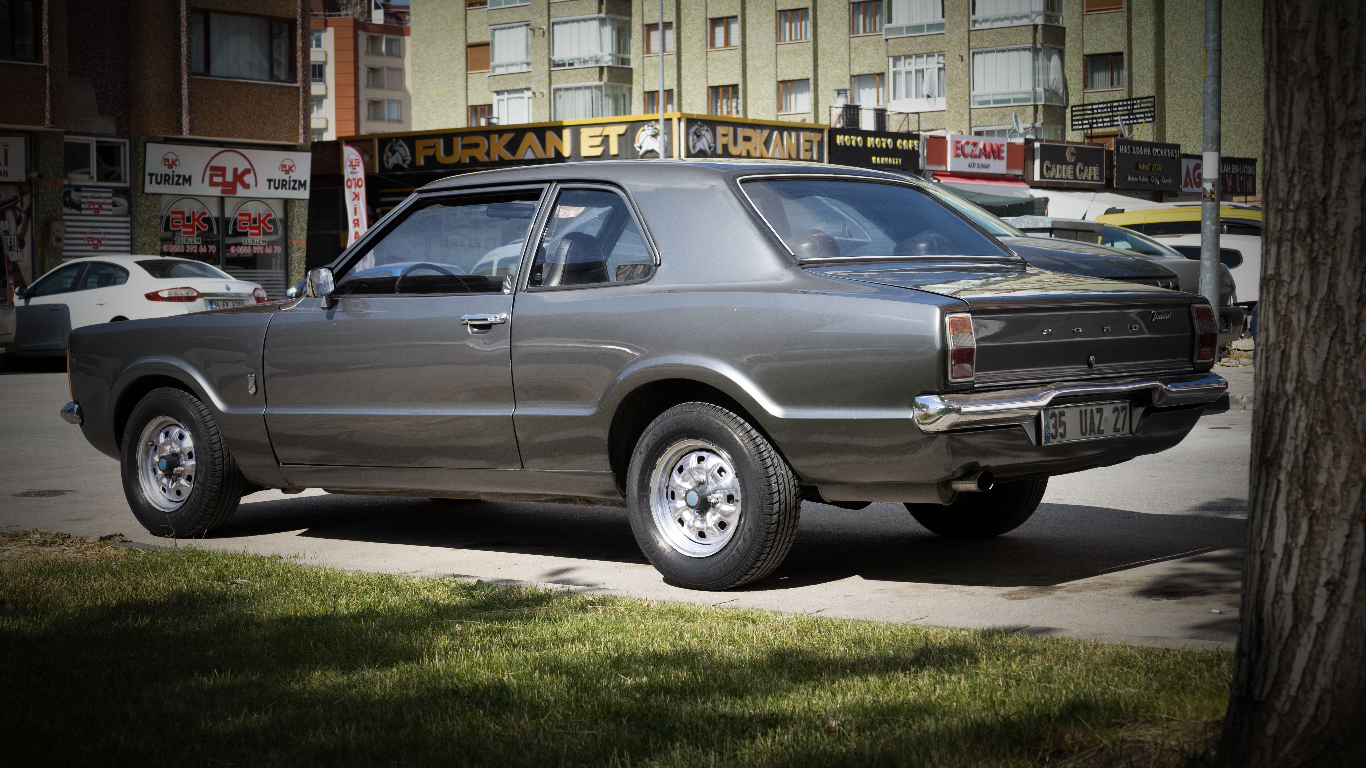 Classic Ford car parked on a sunny street in Konya, Türkiye.