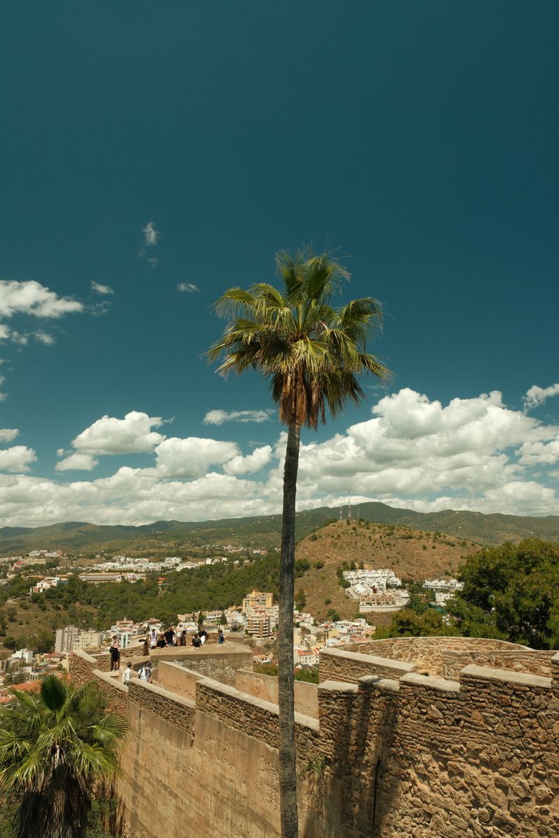 Castle ramparts of Gibralfaro overlooking Málaga with hills behind