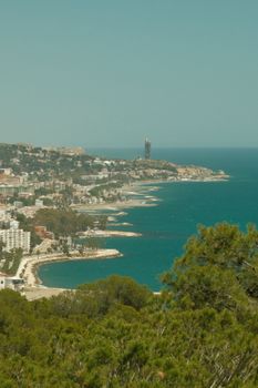 Stunning aerial view of the Mediterranean coast in Spain showcasing beaches and urban landscape.