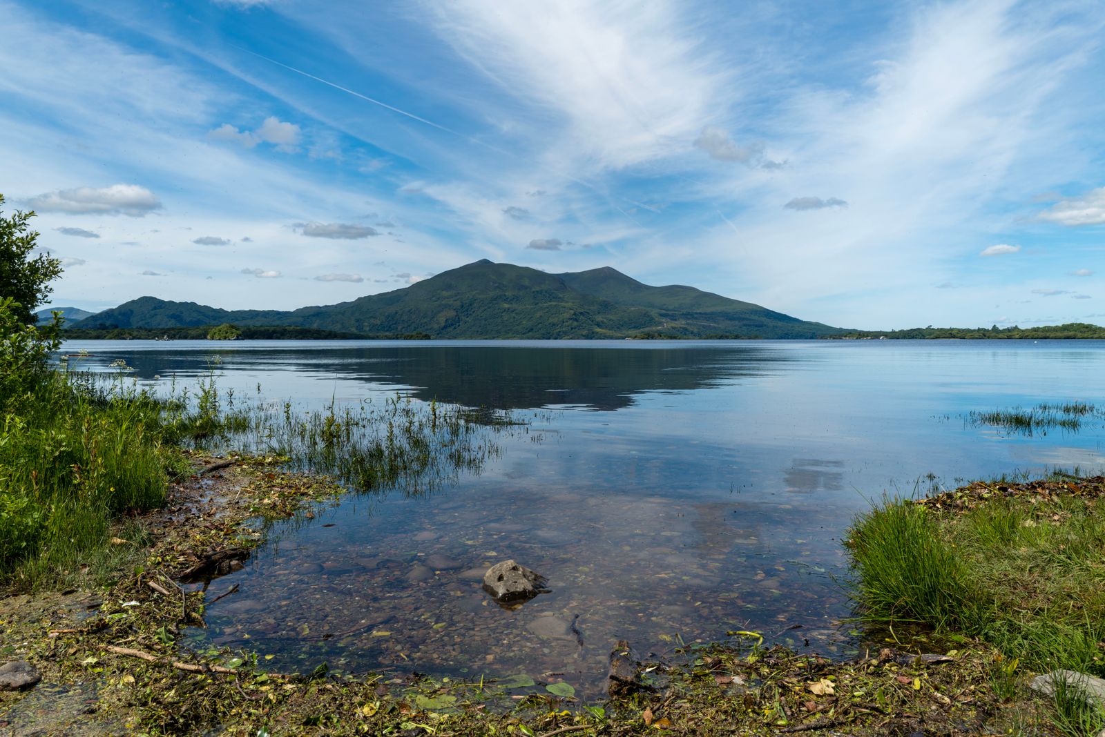 Landscape of Lough Leane with mountains and blue sky in Killarney National Park, Ireland