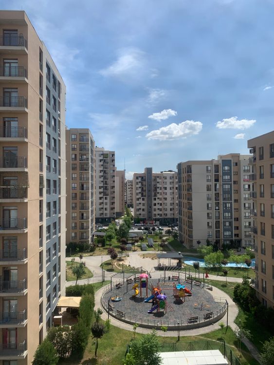 High-rise Apartments Surrounding Urban Playground · Free Stock Photo