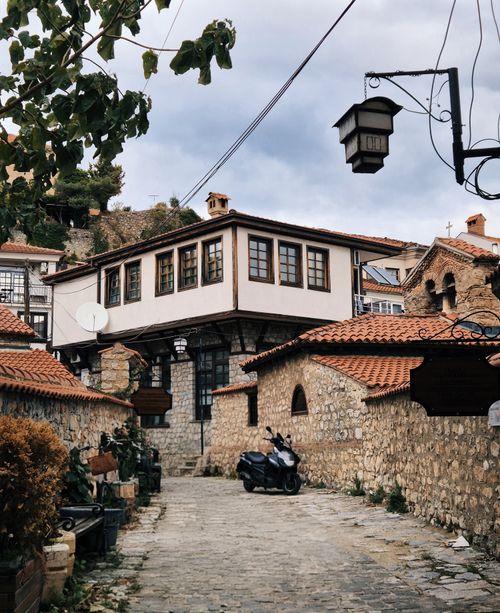Free Explore the picturesque cobblestone streets of Ohrid's Old Town, featuring traditional Ottoman architecture. Stock Photo