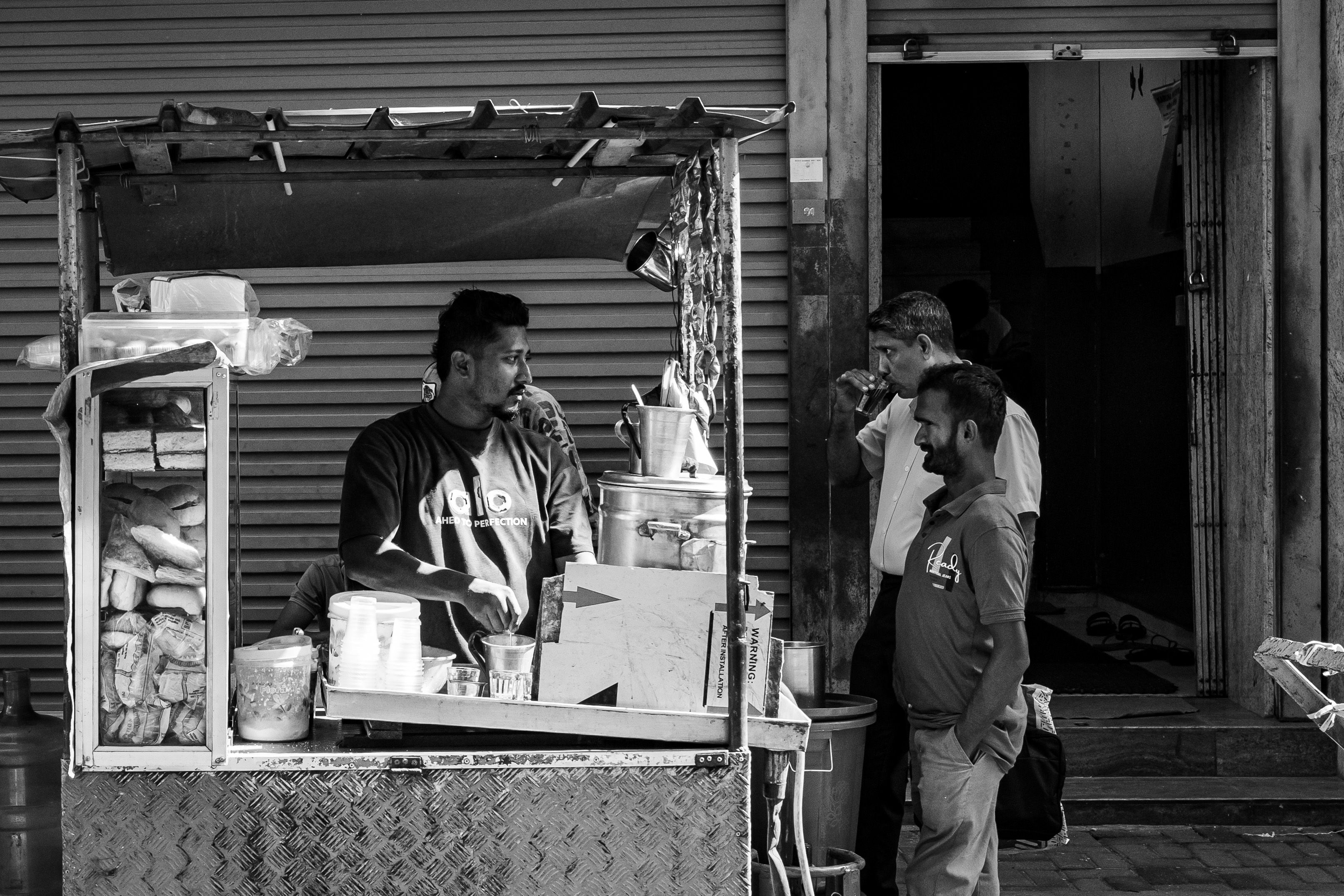 Chef preparing a delicious Chicken Kottu Roti at a street stall in Sri Lanka
