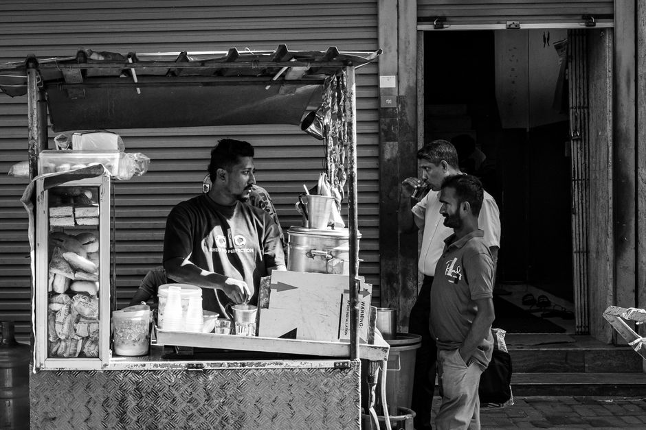Chef preparing a delicious Chicken Kottu Roti at a street stall in Sri Lanka