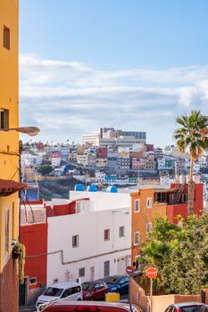 Vibrant street view of Las Palmas de Gran Canaria, showcasing colorful buildings and urban charm.