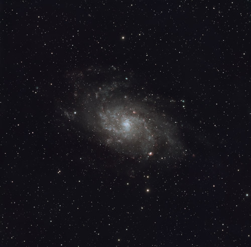 Free Captivating view of a spiral galaxy surrounded by countless twinkling stars in the vast night sky. Stock Photo