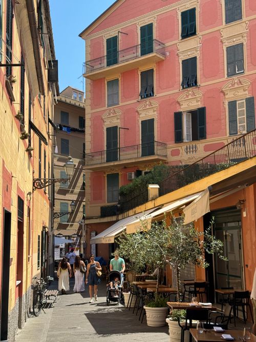 Free A sunny day in Portofino's picturesque alley with colorful buildings and outdoor cafes. Stock Photo