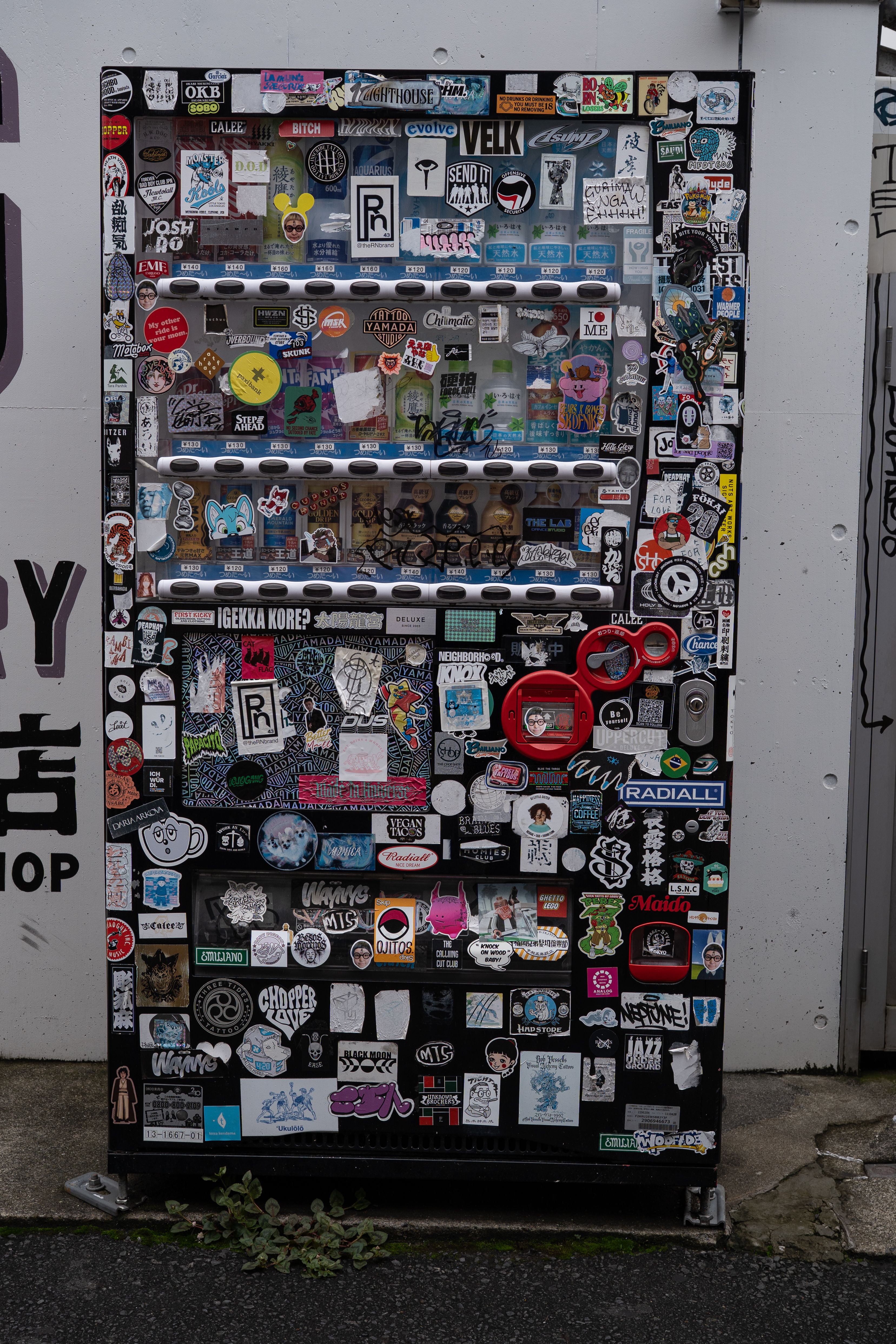 Sticker-Covered Vending Machine in Tokyo Streets · Free Stock Photo