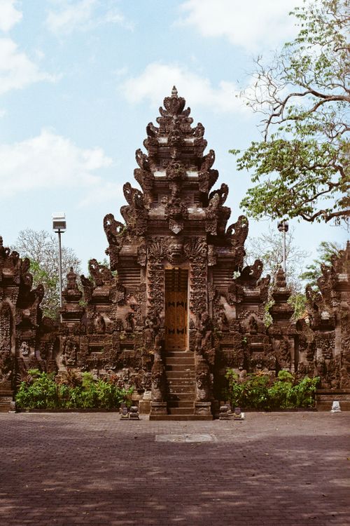 Free Detailed view of traditional Balinese temple architecture with ornate carvings. Stock Photo