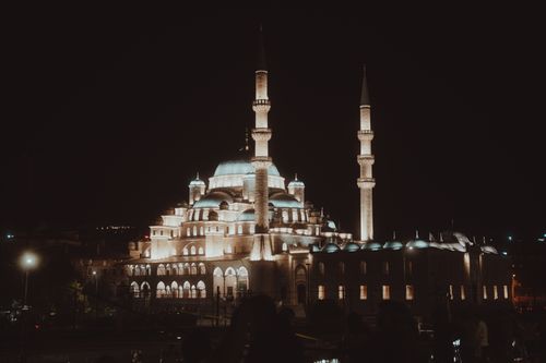 Free Beautiful night view of the illuminated Yeni Mosque, a landmark in Istanbul, Turkey. Stock Photo