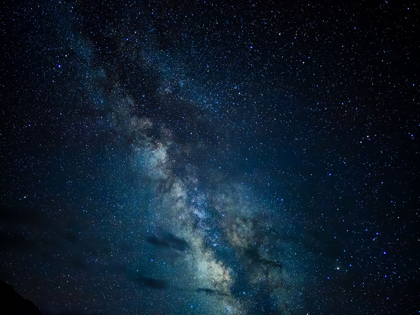 A breathtaking glimpse of the Milky Way galaxy under a clear night sky, showcasing countless stars.