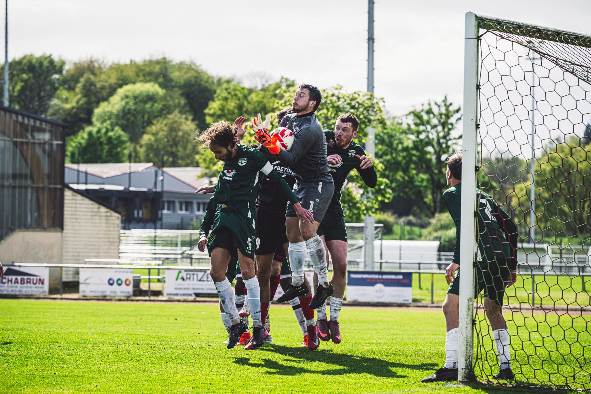 Norway defenders organizing a defensive wall during a tense World Cup qualifier in a packed Scandinavian stadium