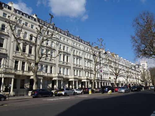 Free Historic row of terraced houses in London on a bright sunny day. Stock Photo