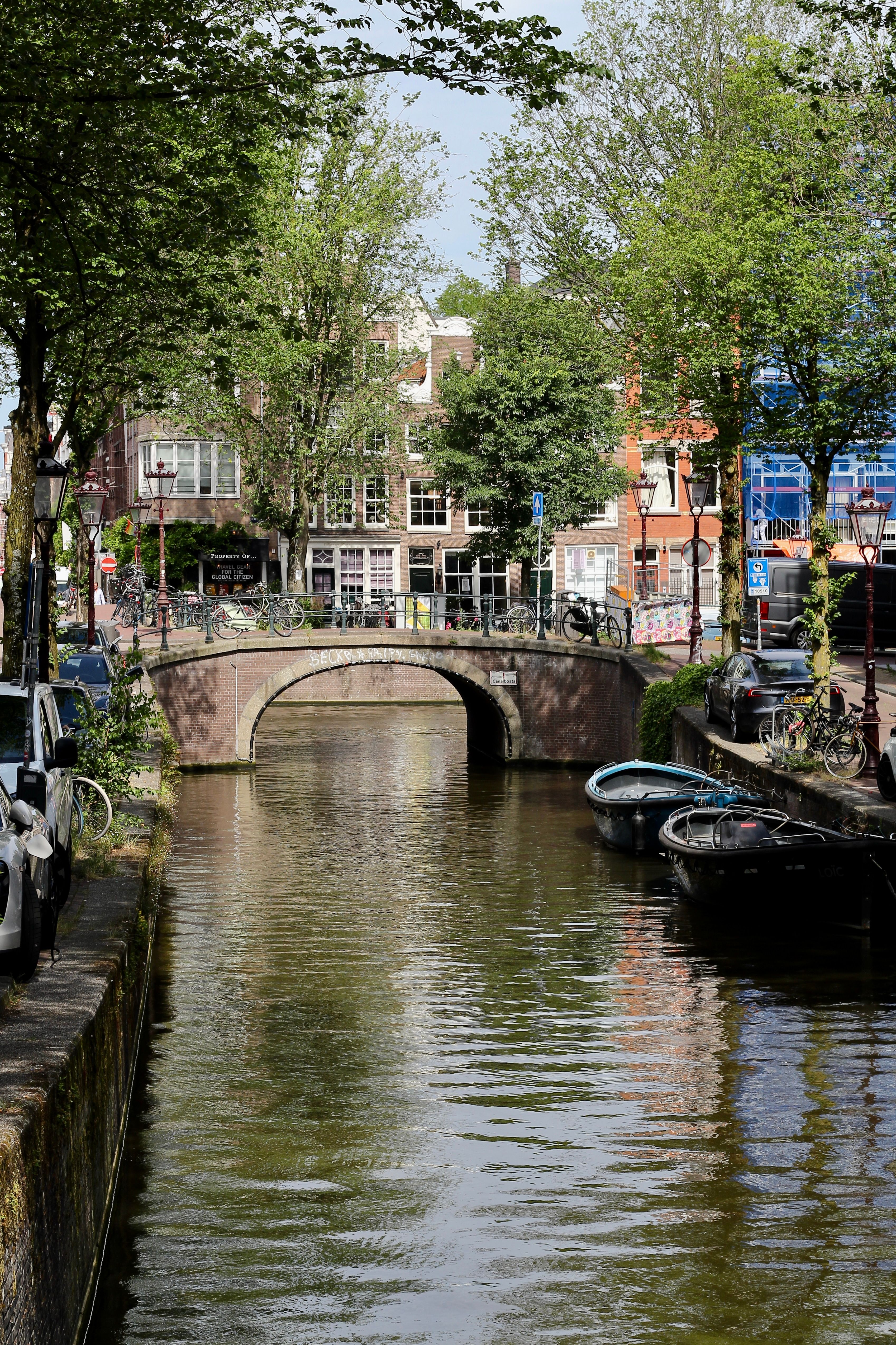 Amsterdam canal with bridge in summer