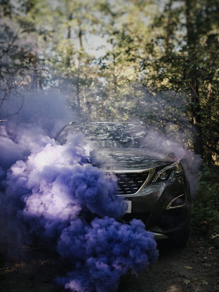 Parked SUV With Purple Smoke