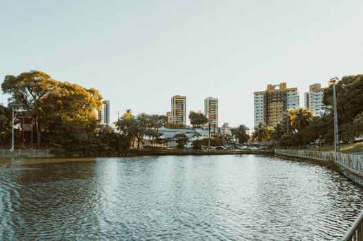 Scenic view of a waterfront with modern buildings in Natal, RN, Brazil during a sunny day.