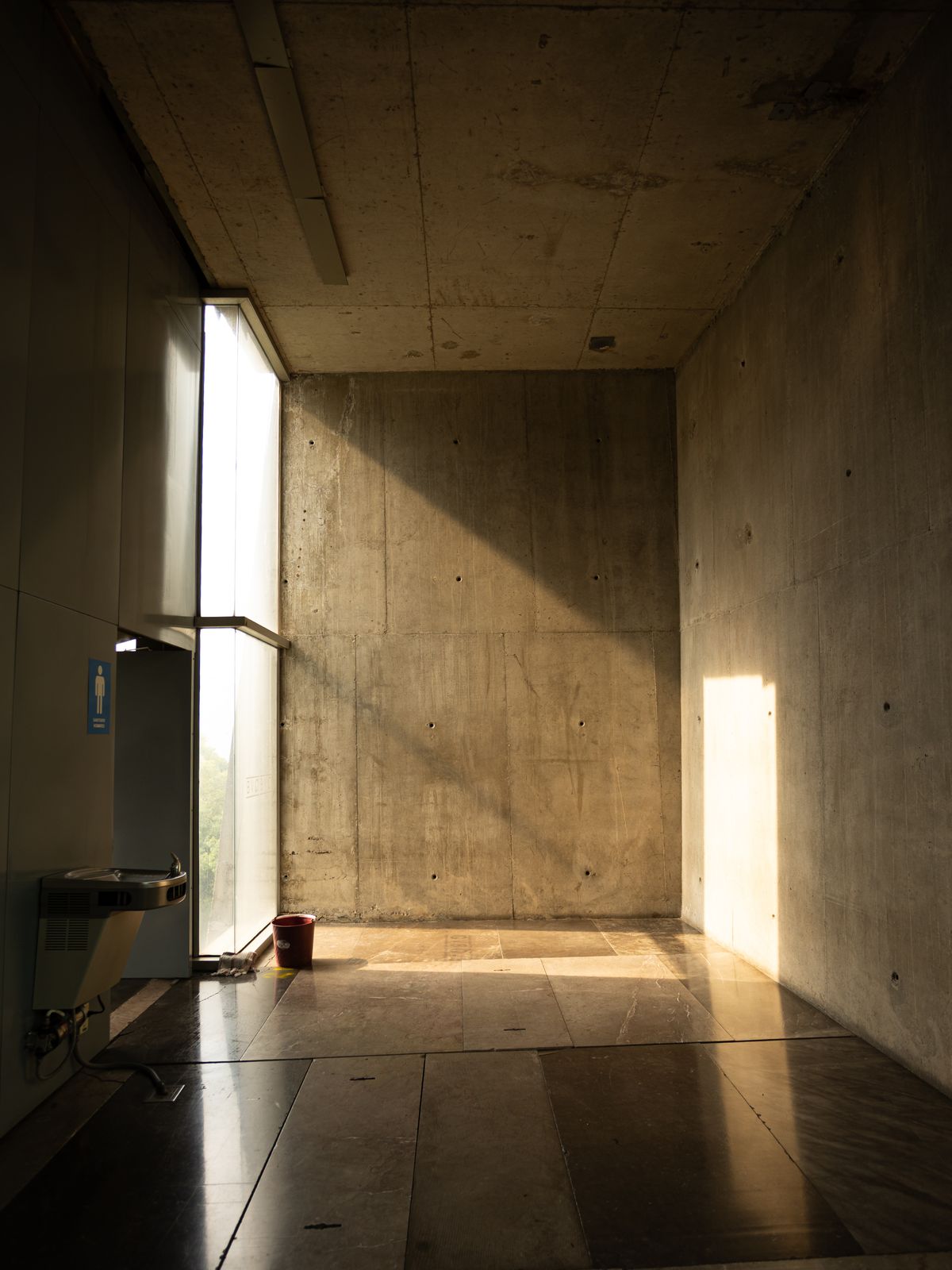 Sunlit concrete interior of a private residence