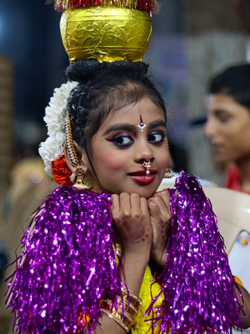 Free Young girl in vibrant traditional Indian attire and makeup participating in a cultural festival event. Stock Photo