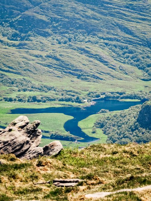 Free A breathtaking view of the Gap of Dunloe valley and lake in Ireland, showcasing lush greenery and rugged terrain. Stock Photo