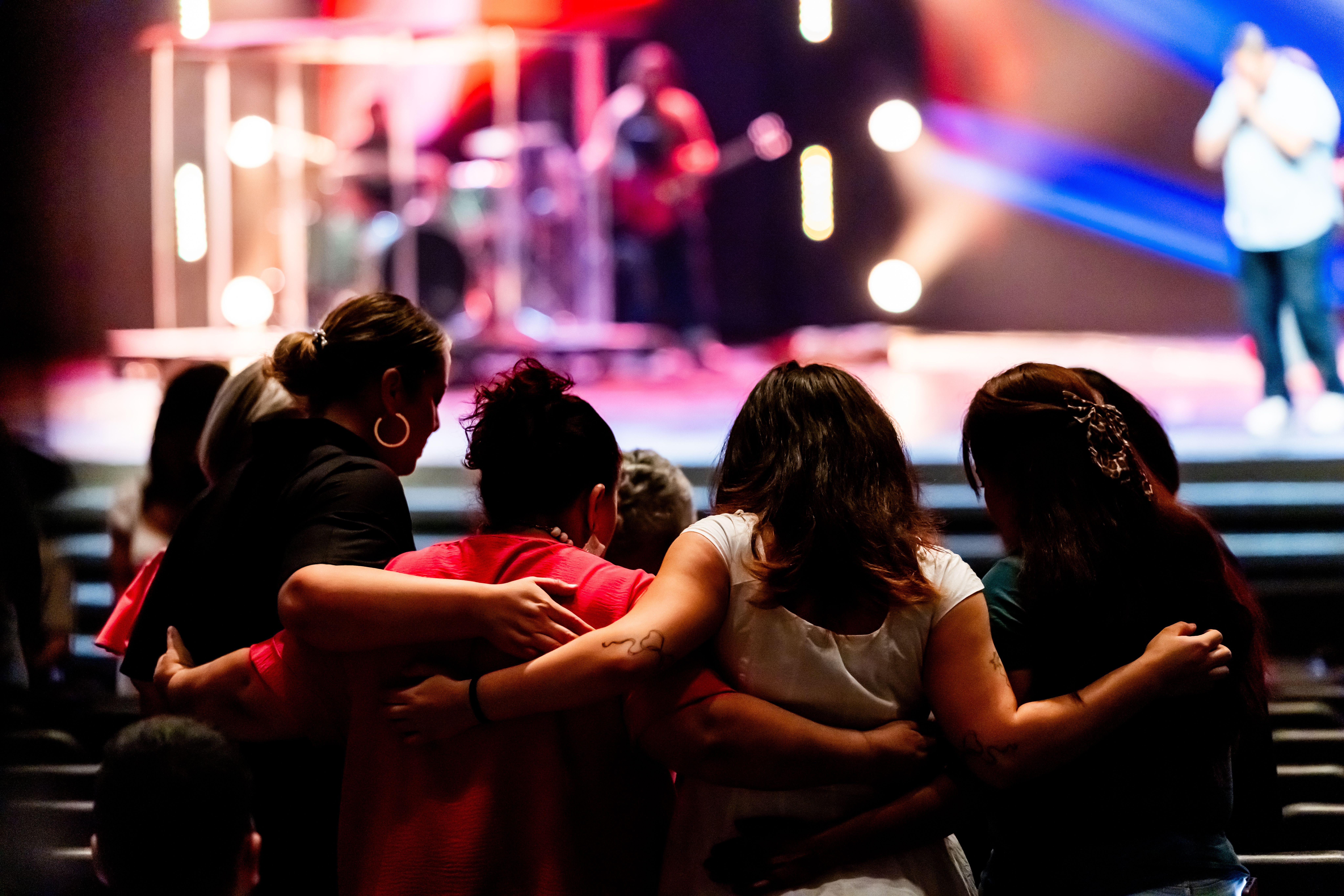 Diverse audience members from around the world watching the same virtual concert on different devices