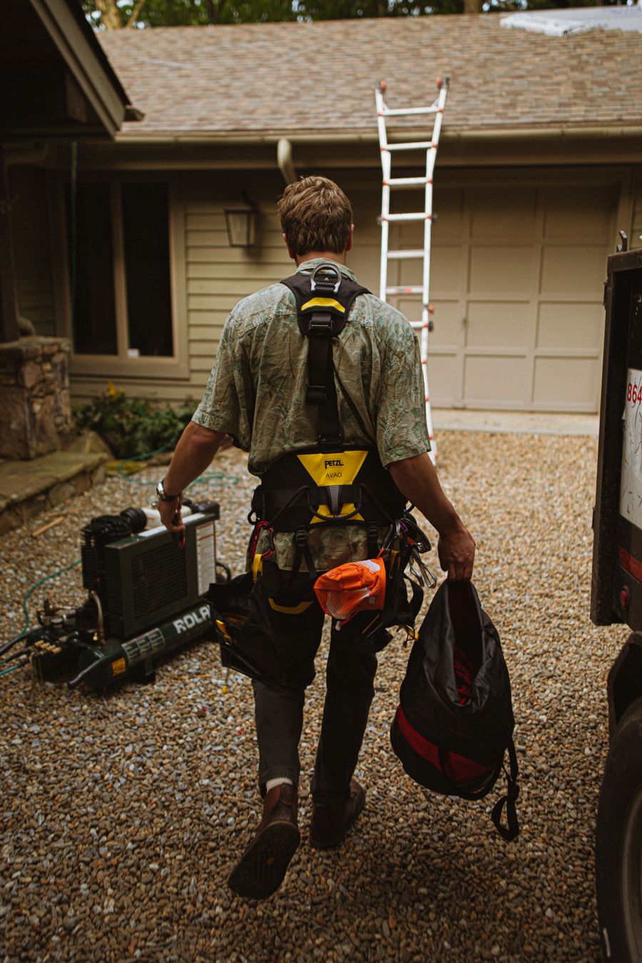 Roofer at work on residential building