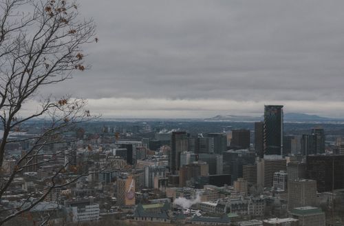 Free A cloudy day view of Montreal's skyline, showcasing the city's high-rise buildings and urban landscape. Stock Photo