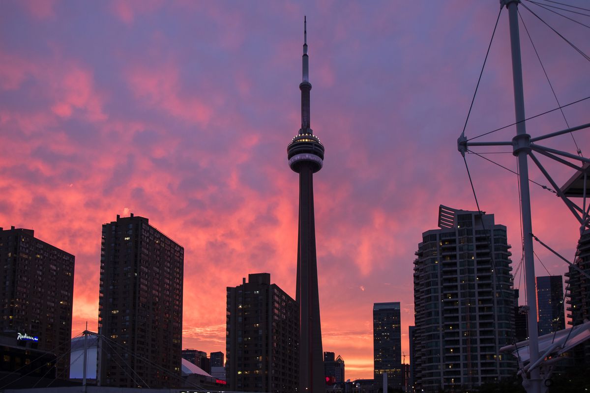 Toronto skyline silhouette at sunset with the CN Tower