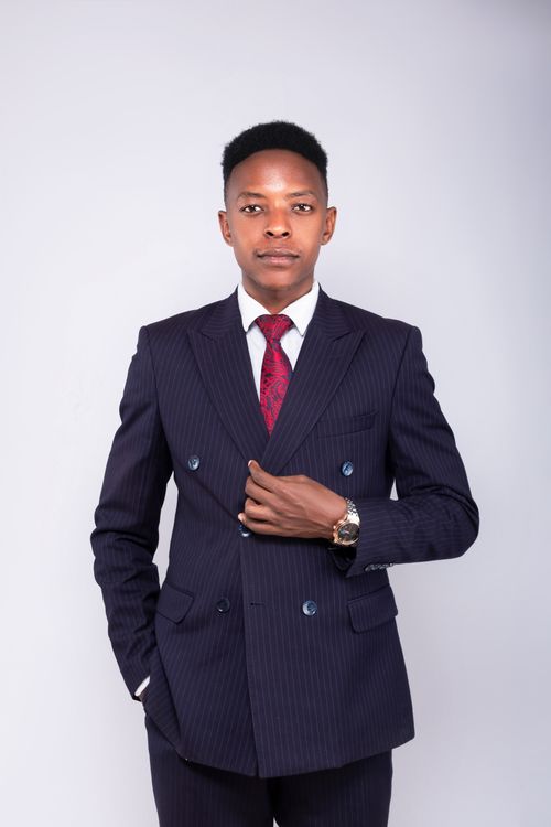 Free Studio portrait of a professional man in a suit with white background. Stock Photo