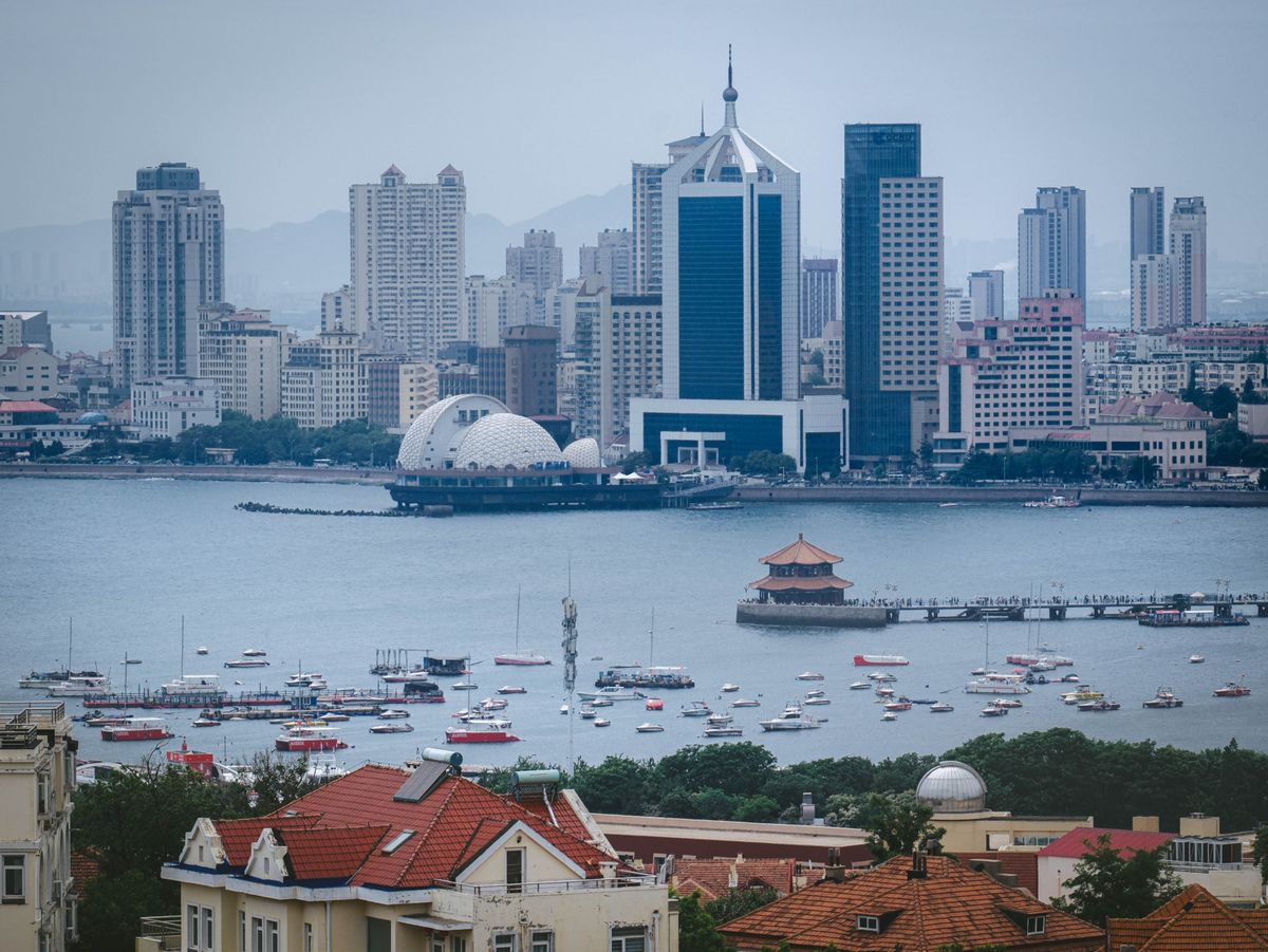 Captivating view of Qingdao's modern urban skyline curving around the bay on the Yellow Sea